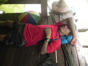 While some work, others take a nap. He carried one of our heavy medicine backpacks.