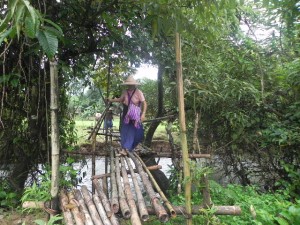 Tuesday morning, our last morning to visit another village. Here we are crossing a river on a bamboo bridge.