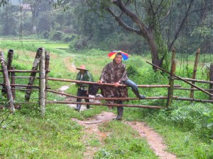 Crossing over bamboo fences.