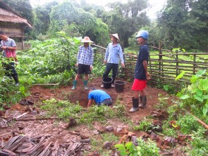 Friday was busy. I and some students helped me in treating many people in that village. The other students cooked the meals and some built bathrooms. Here they are digging the hole.