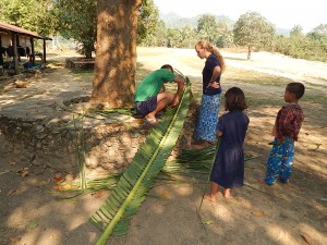 cutting palm branches for the arch,