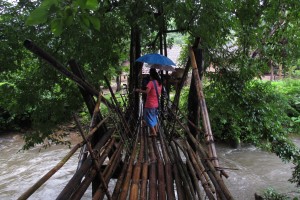 Crossing a scary bamboo bridge