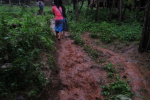 Next we headed to another house as the rain came down hard and the trails turned into little rivers.